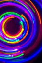 Christmas tree lights spun around to achieve a spiral glowing effect; abstract circular color trails