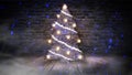 Christmas tree with lights on the wooden floor, lights, lights, lights, glare, smoke. Royalty Free Stock Photo