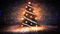 Christmas tree with lights on the wooden floor, lights, lights, lights, glare, smoke. Royalty Free Stock Photo