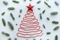 A Christmas tree made of beads and a star on top. Celebratory concept. Royalty Free Stock Photo