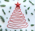 A Christmas tree made of beads and a star on top. Celebratory concept. Royalty Free Stock Photo