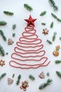 A Christmas tree made of beads and a star on top. Celebratory concept. Royalty Free Stock Photo