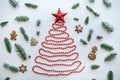 A Christmas tree made of beads and a star on top. Celebratory concept. Royalty Free Stock Photo