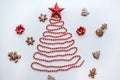 A Christmas tree made of beads and a star on top. Next to it lie the traditional gingerbread. Royalty Free Stock Photo