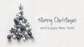 Christmas tree made of blue balls on grey background. Happy New Year Royalty Free Stock Photo