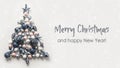 Christmas tree made of blue balls on grey background. Happy New Year Royalty Free Stock Photo