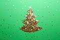 Christmas tree made of confetti stars on green background, flat lay Royalty Free Stock Photo