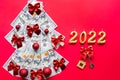 Christmas tree made of 100 dollar bills and House key, candles with the numbers 2022. Christmas decor of finance, savings, wealth Royalty Free Stock Photo