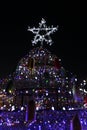 A Christmas tree made fish nets with lights and a star Royalty Free Stock Photo