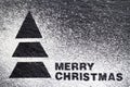 Christmas tree made of flour on black background, Merry Christmas lettering, creative christmas background Royalty Free Stock Photo