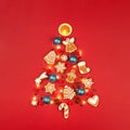 Christmas tree made of gingerbread cookies and garland. Royalty Free Stock Photo