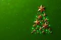 Christmas tree made of gold stars on luxury green background Royalty Free Stock Photo