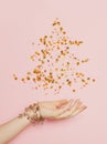 Christmas tree made from golden confetty stars on pink background. Minimal Christmas card Royalty Free Stock Photo