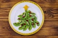 Christmas tree made of kiwi slices and pomegranate on wooden table. Top view. Creative idea for Christmas and New Year festive Royalty Free Stock Photo