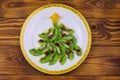 Christmas tree made of kiwi slices and pomegranate on wooden table. Top view Royalty Free Stock Photo