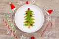 Christmas tree made of kiwi slices on wooden table Royalty Free Stock Photo
