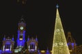 Christmas tree made with luminous LEDs at night next to the historical building of the city hall of Valencia, Spain Royalty Free Stock Photo