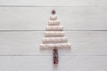 Christmas tree made of marshmallow candy, anise and cinnamon sticks on a white background wooden boards. Christmas concept. Space Royalty Free Stock Photo