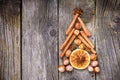 Christmas tree made of nuts, spices and dried oranges. Royalty Free Stock Photo