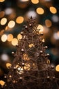 a christmas tree made out of wire is shown in front of a blurred background Royalty Free Stock Photo