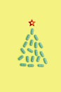 Christmas tree made of pills for Christmas, conceptual background on the New Year theme for medicine and pharmacy Royalty Free Stock Photo