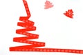 Christmas tree made of red ribbon on white background, isolate. Christmas and new year concept