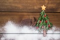 Christmas tree made of rosemary and pomegranate with star-shaped cookie Royalty Free Stock Photo