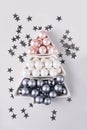 Christmas tree made of silver pastel balls on grey