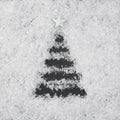 Christmas tree made in snow on a black background. Top view. Flat lay Royalty Free Stock Photo