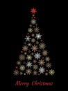 Christmas tree made from snowflakes isolated on black background.