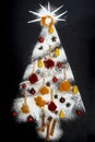 Christmas tree made from various spices, wooden spoons and sugar powder Royalty Free Stock Photo