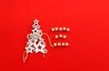 Christmas tree made of white wooden stars with snowflake and craft rope and words Happy New Year written on small bricks on bright Royalty Free Stock Photo