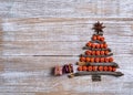 Christmas tree made of wooden branches and rowan berries. New Year celebration concept with Christmas tree with star Royalty Free Stock Photo