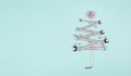 Christmas tree made with wrenches, baubels and a star, new year greeting card with repair tools Royalty Free Stock Photo