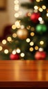 Festive Wooden Table with Blurred Christmas Lights Background Royalty Free Stock Photo