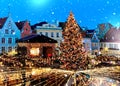 Christmas tree marketplace  illumination decorated in medieval city Tallinn old town hall square winter city travel to Estonia Royalty Free Stock Photo