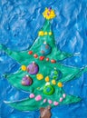 Christmas tree molded with plasticine on card