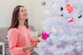 Christmas tree and new year concept photo in white-pink hue. Royalty Free Stock Photo