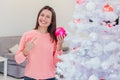 Christmas tree and new year concept photo in white-pink hue. Royalty Free Stock Photo