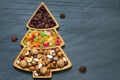 Christmas tree with nuts and dried fruits on dark background Royalty Free Stock Photo