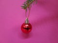 Christmas tree ornament on a pink background Royalty Free Stock Photo