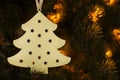 Christmas tree ornament, white pine on black background with flash of lights Royalty Free Stock Photo