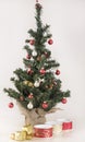 Christmas Tree, ornaments,gifts and silk ribbons Royalty Free Stock Photo