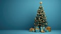 A christmas tree with ornaments and presents in front of a blue wall Royalty Free Stock Photo