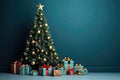 A christmas tree with ornaments and presents in front of a blue wall Royalty Free Stock Photo