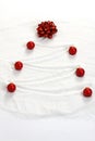 Christmas tree painted in snow with red bow and red matt christmas balls