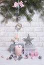 Christmas Tree Pine Branches with silver gifts, pink cup, star, candles, cones and balls and Christmas toy on a light vertical Royalty Free Stock Photo