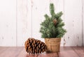 Christmas tree with pine cone on wooden background Royalty Free Stock Photo