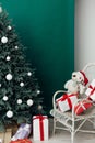 Christmas tree pine with gifts new year decor green background Royalty Free Stock Photo