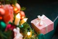 Christmas tree with pink decorations and gifts under it in the loft interior Royalty Free Stock Photo